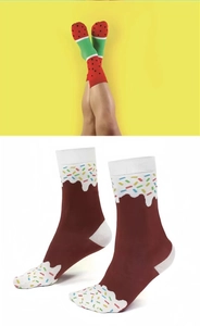 Detailed view of novelty mid-calf socks with vibrant watermelon and donut patterns