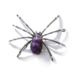 Artistic spider ornament made of natural purple amethyst crystal and silver metal frame