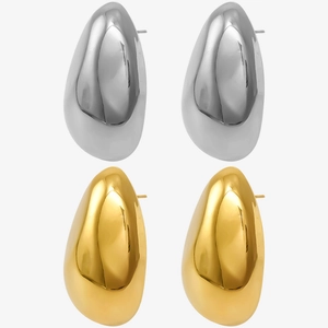 Close-up of gold and silver teardrop earrings in polished 304 stainless steel