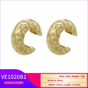 Detail of 18K gold-plated brass ear cuff featuring a vintage hammered texture finish