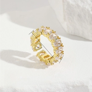 Macro detail of copper zircon open ring on gypsum base with product dimensions
