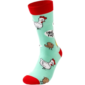 Detail of pixel art rooster socks with I WAS FIRST text and mint green knit texture