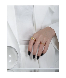 Detailed close-up of minimalist gold S925 silver rings with zircon and mother of pearl