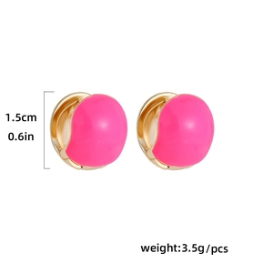 Macro detail of gold-toned hoop earring with bright pink enamel and size dimensions