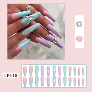 Detail of long coffin nails with pink and turquoise gradient, sequins and rhinestones