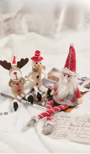 Close-up of handmade wool felt Christmas ornaments including Santa, snowman, and reindeer