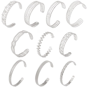 Collection of ten vintage silver stainless steel open bangles with geometric patterns