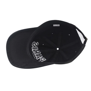 Detail of internal embroidery and 100% cotton wash label on the black baseball cap