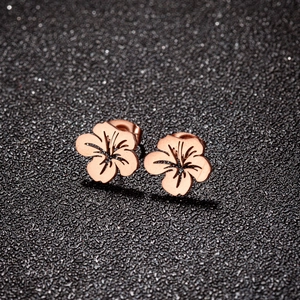 Elegant rose gold cutout floral stud earrings made of stainless steel for women
