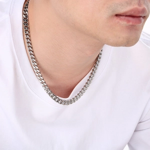 8mm silver stainless steel Cuban link chain necklace worn by male model on white background