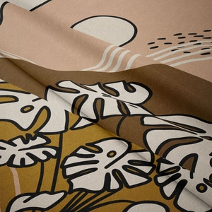 Detail of soft fabric tapestry showing abstract monstera leaves and geometric patterns