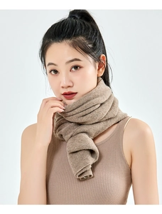 Close-up of soft camel cashmere blend knit scarf texture on model with white background