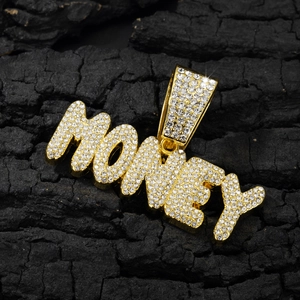 Close-up of golden Money letter pendant with clear rhinestones on black background
