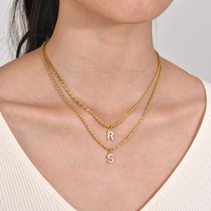 Double-layered gold titanium steel necklace with sparkling crystal letters R and S charms