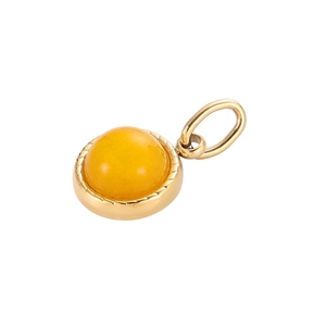 Close-up of golden stainless steel round pendant featuring an amber gemstone inlay