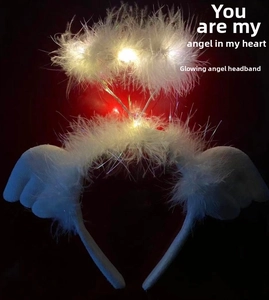 Close-up of LED glowing angel halo headband with white feathers and wings decor