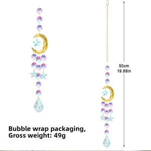 Detailed view of 50cm moon suncatcher featuring crystal prism and gold metal stars