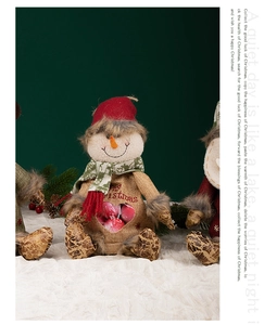 Detailed view of burlap snowman ornament with heart window and Merry Christmas text