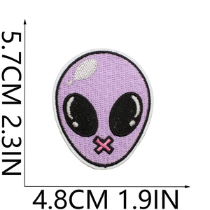 Detail view of purple alien embroidery patch showing dimensions 5.7cm by 4.8cm on white base