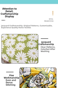 Detail showing dense jacquard weaving texture of white daisies on green floral outdoor blanket