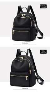 Comparison showing small and large black waterproof nylon backpacks with gold zippers