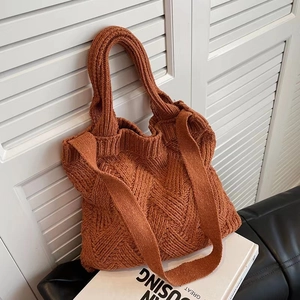 Detail of caramel knit tote bag showing thick wool texture and diamond weave pattern