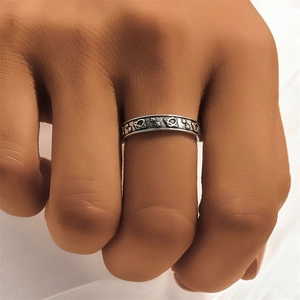 Detailed view of vintage 925 silver ring featuring embossed sun, moon and star patterns