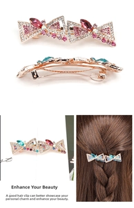 Detail view of red bow hair clip with sparkling multi-color crystals and rhinestones