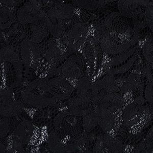 Gros plan macro de dentelle florale noire complexe avec texture de maille délicate