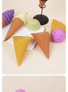 Close-up of colorful artificial ice cream scoops and textured waffle cones for DIY crafts