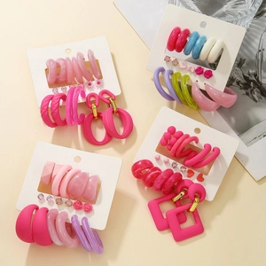 Detail of 6-pair earring sets with pink resin hearts and faux pearls on display cards