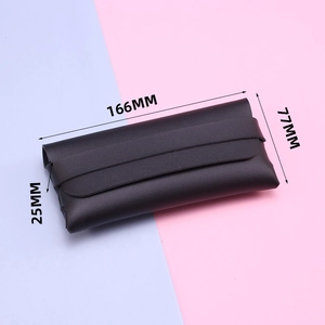 Detail view of coffee faux leather sunglass pouch with elastic band and dimensions 166x77x25mm