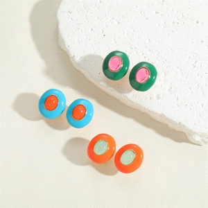 Three pairs of vintage oval enamel stud earrings in colorful contrasting macaron shades