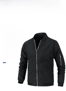 Close-up of black bomber jacket featuring silver metal zipper and utility sleeve pocket