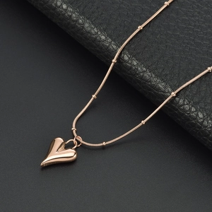 Rose gold 18K heart pendant necklace on beaded snake chain, elegant jewelry for women