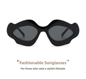 Close-up of black irregular wave frame sunglasses with dark lenses for avant-garde style
