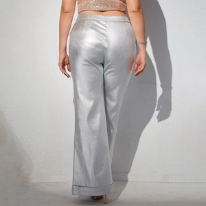 Detail shot of women's metallic silver wide leg trousers featuring a shimmery reflective finish
