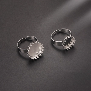 Macro shot of silver crown-shaped adjustable ring blanks for DIY jewelry crafting