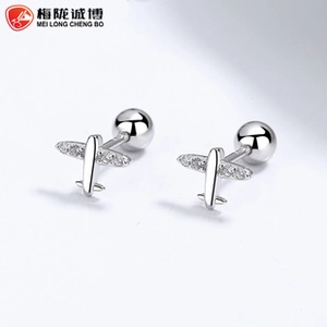 Detail of silver airplane earrings with sparkling crystals and screw back closures