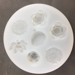Top view of white lotus and seed pod silicone mold with 7 unique floral cavities