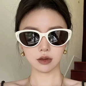 Fashionable white cat-eye sunglasses with dark lenses for women and men, stylish chic design