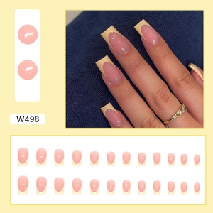 Detail of 24pcs square French tips in nude pink and pale yellow with model hands