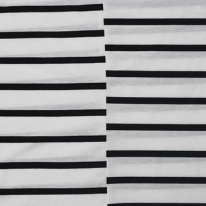 Close-up of the knitted fabric texture with horizontal black and white stripes