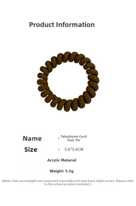Macro detail of brown matte spiral telephone wire hair tie made of durable acrylic material