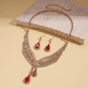 Macro detail of luxury teardrop necklace set with red rubies and white crystals