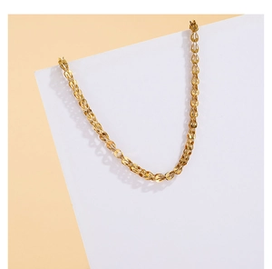 Detailed close-up of golden phoenix tail chain links with polished hollow metal texture