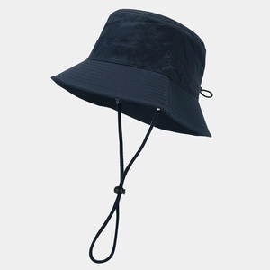 Detail of waterproof quick-dry fabric and adjustable windproof cord on navy sun hat