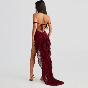 Detailed back view of burgundy lace dress with open back and elegant trailing hemline