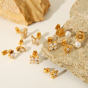 Golden butterfly and zircon star stud earrings set in stainless steel for women