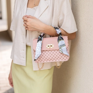 Pink printed crossbody bag with silk scarf handle and golden chain strap for women